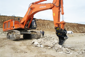 Geith Ripper Tooth mounted on orange excavator for breaking hard ground